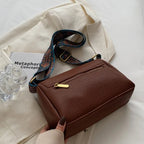 Besace conçue comme sac à main