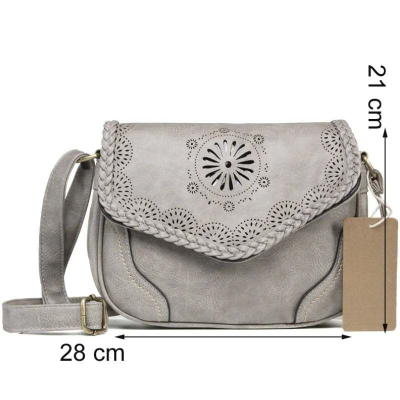 Besace femme portée à l’épaule comme sac à main