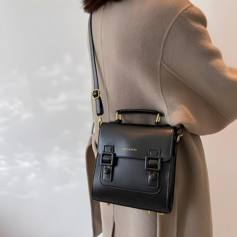 Cartable féminin porté comme sac à main