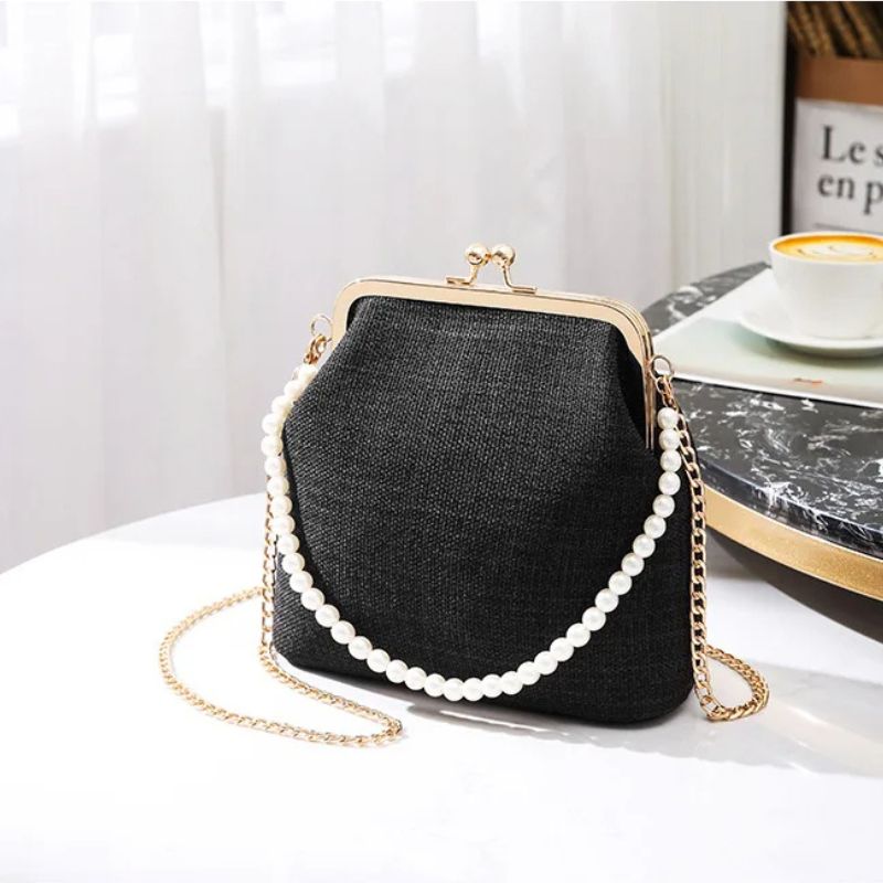 Élégant sac porté à la main avec poignée perlée