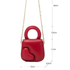 Petit sac cœur muni d’une chaîne