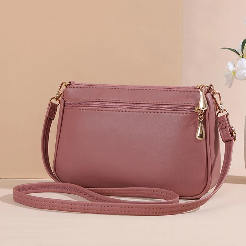 Petit sac en simili effet matelassé, à main et bandoulière