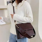 Sac à bandoulière effet croco