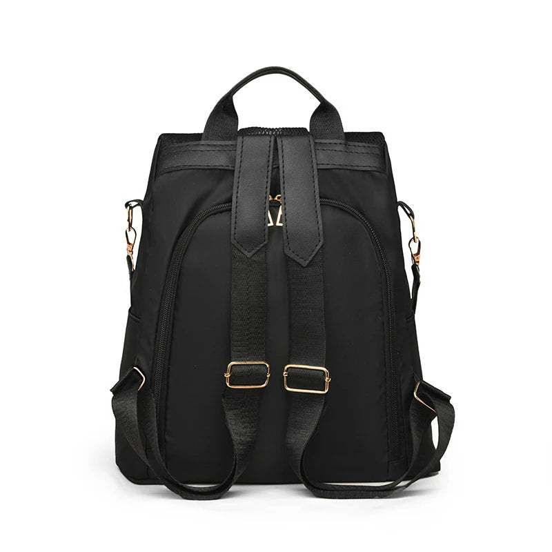 Sac à dos noir en toile orné de paillettes