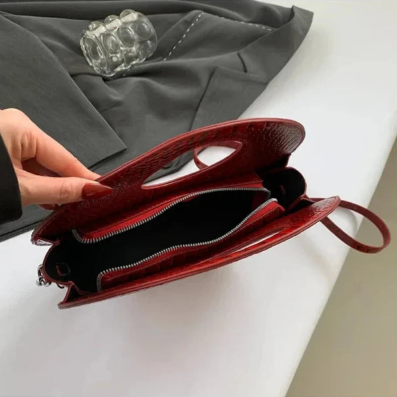 Sac à main au format rond imitation crocodile