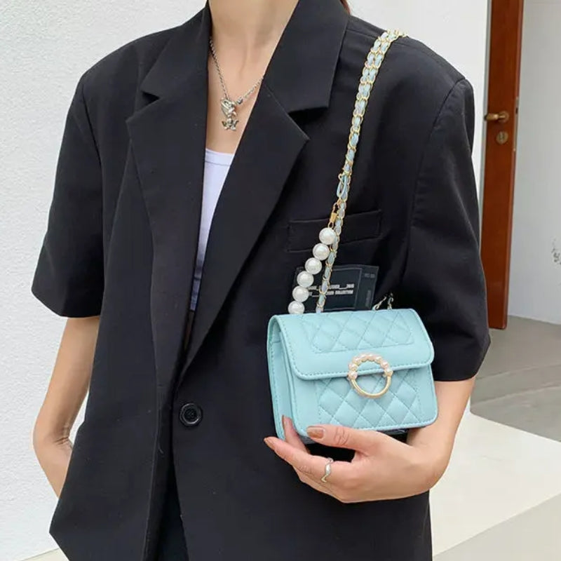 Sac à main au motif matelassé avec perles