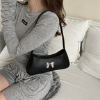 Sac à main avec nœud décoratif en forme baguette glamour