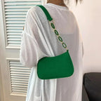 Sac à main baguette au design réduit et teinte audacieuse