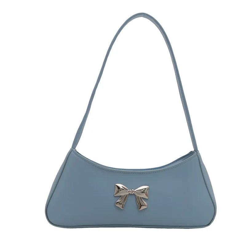 Sac à main baguette avec nœud décoratif au style glamour