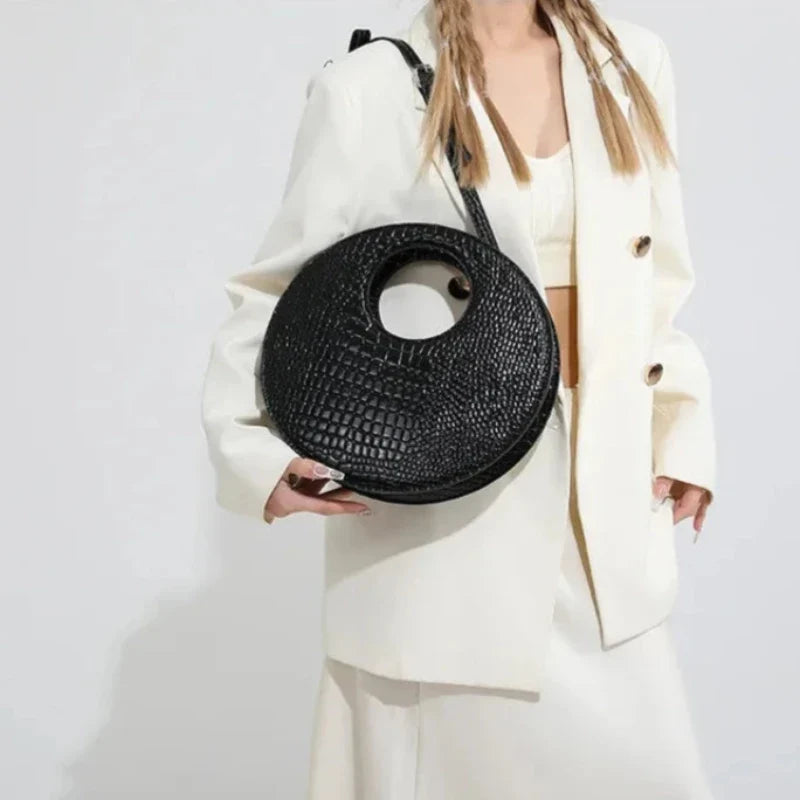 Sac à main effet crocodile au design rond