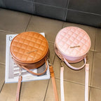 Sac à main effet matelassé au design rond