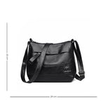 Sac à main féminin en simili muni d'une bandoulière