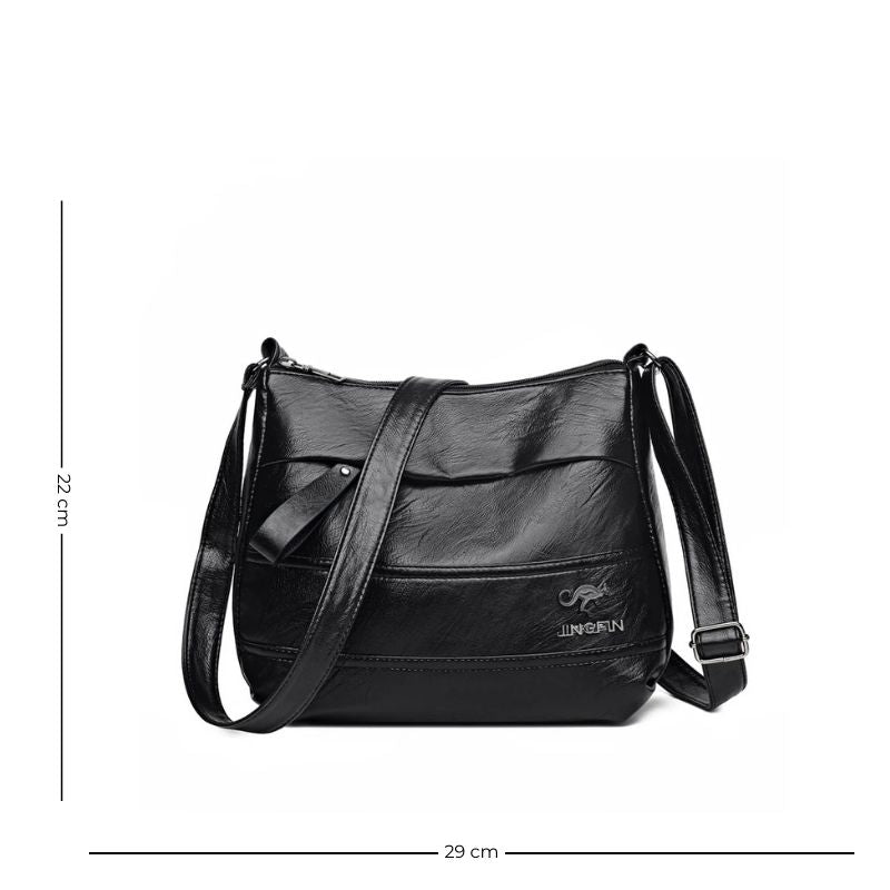 Sac à main féminin en simili muni d'une bandoulière