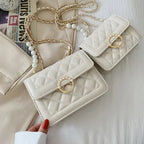 Sac à main perlé au style matelassé