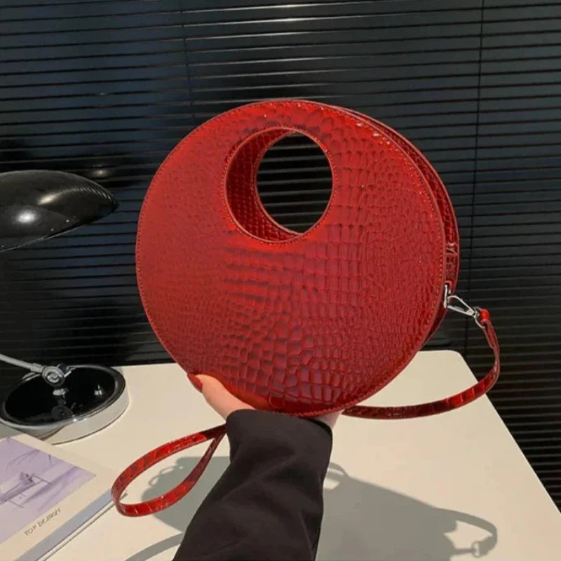 Sac à main rond au rendu crocodile