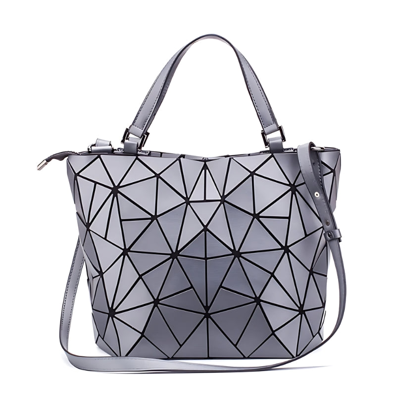 Sac à motif géométrique porté à la main