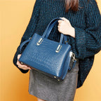 Sac bandoulière cuir effet crocodile au design glamour