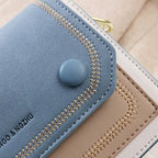 Sac bicolore en bandoulière au style cartable