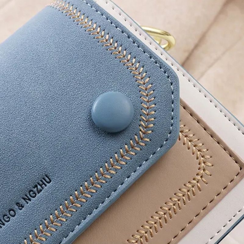 Sac bicolore en bandoulière au style cartable