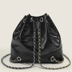 Sac bourse lumineux imitation peau de crocodile
