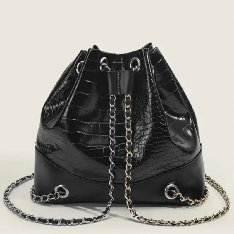 Sac bourse lumineux imitation peau de crocodile