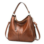 Sac brun à main et bandoulière
