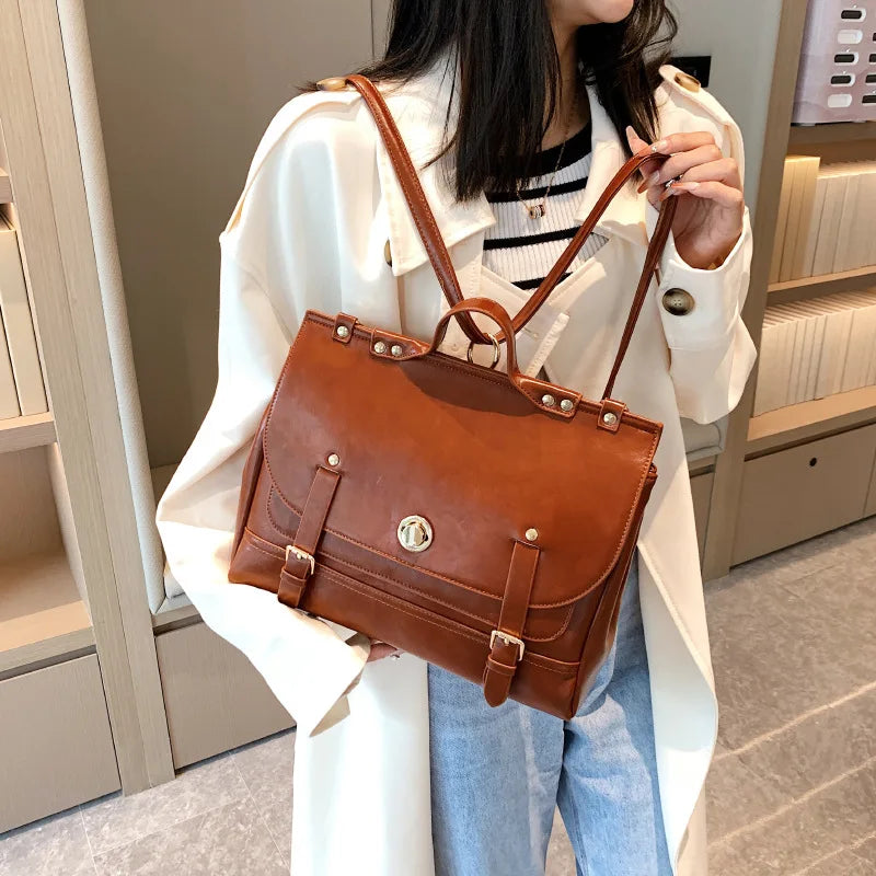 Sac cartable conçu pour être porté à la main