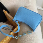 Sac compact au style baguette et à la teinte vive
