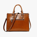 Sac cuir marron porté à la main