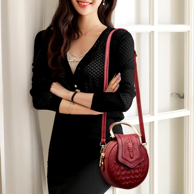 Sac effet croco rond à main en cuir