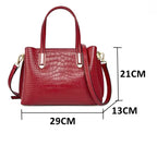 Sac en cuir effet croco au style glamour avec bandoulière