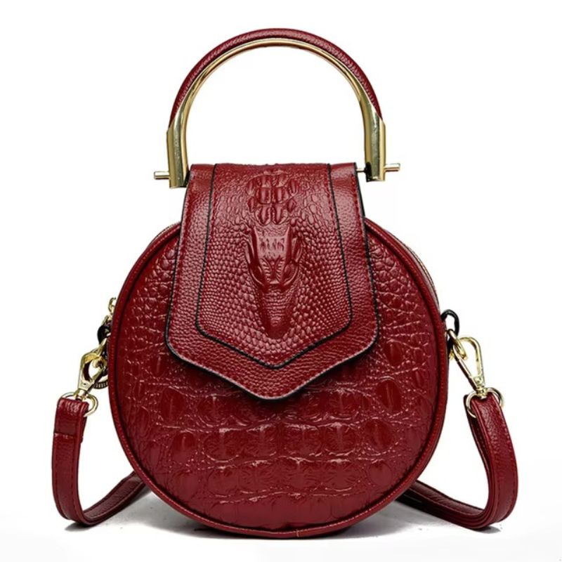 Sac en cuir façon croco rond porté main