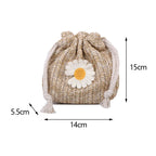 Sac féminin en forme de bourse avec pâquerette