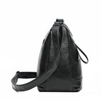 Sac féminin en simili accompagné d'une bandoulière