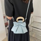 Sac femme chic au format bourse avec nœud papillon