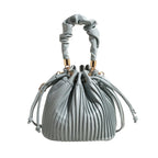 Sac femme forme bourse, bleu et flexible
