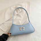 Sac glamour de forme baguette avec nœud décoratif