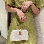 Sac luxueux de mariage agrémenté d’une feuille dorée