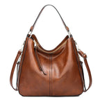 Sac marron avec bandoulière et porté main