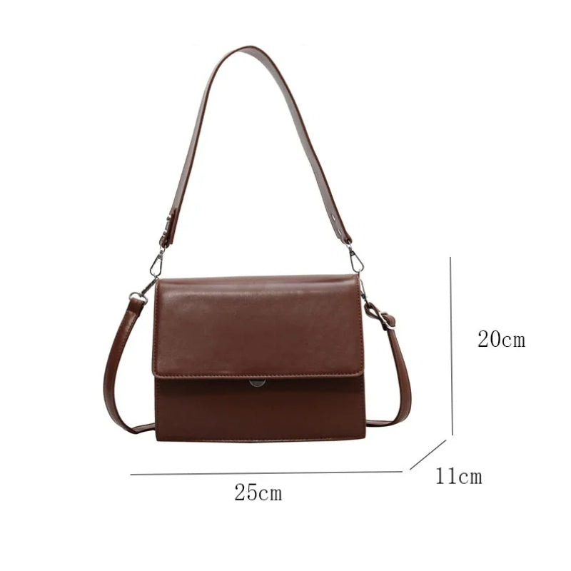 Sac noir à main et bandoulière