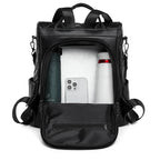 Sac noir matelassé en simili pour femme main et dos