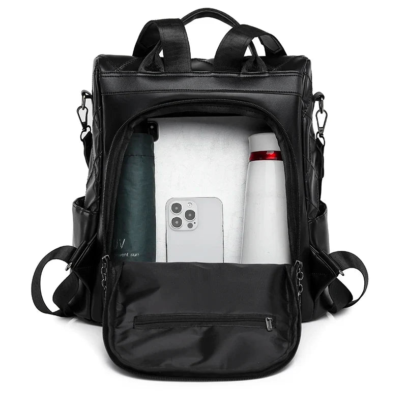 Sac noir matelassé en simili pour femme main et dos