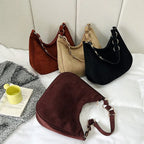 Sac pour femme en simili, porté en bandoulière avec élégance