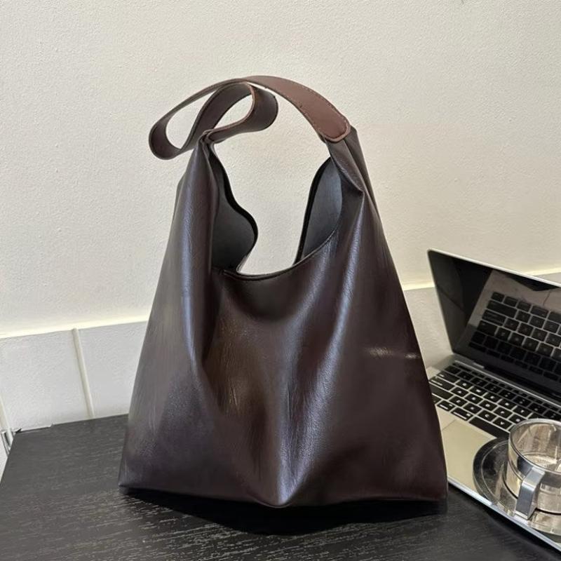 Sac rétro souple porté main