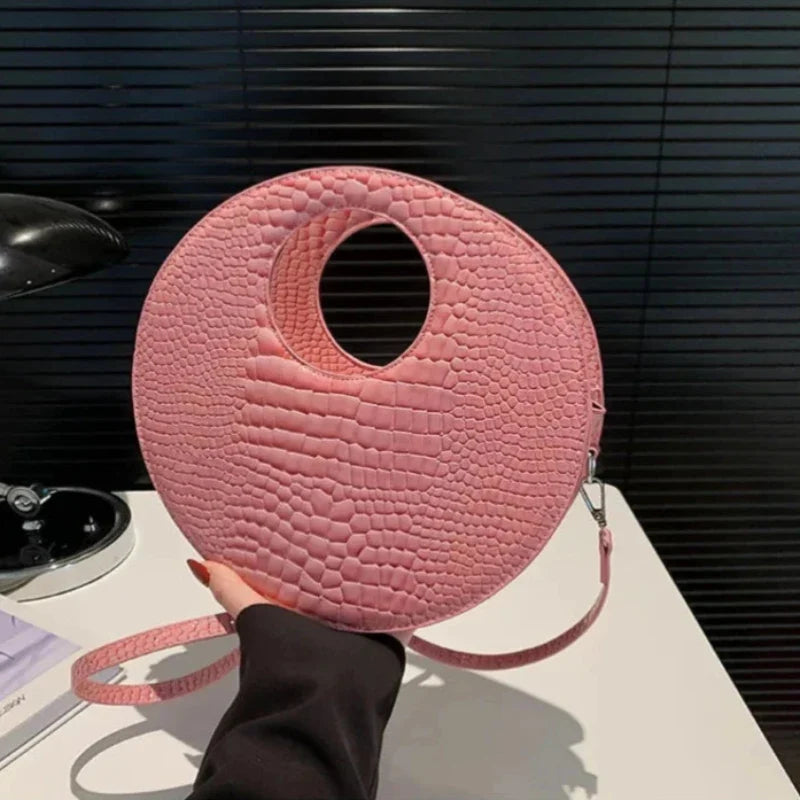 Sac rond à main avec effet crocodile