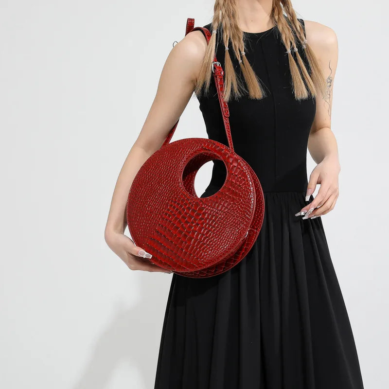 Sac rond au fini effet crocodile