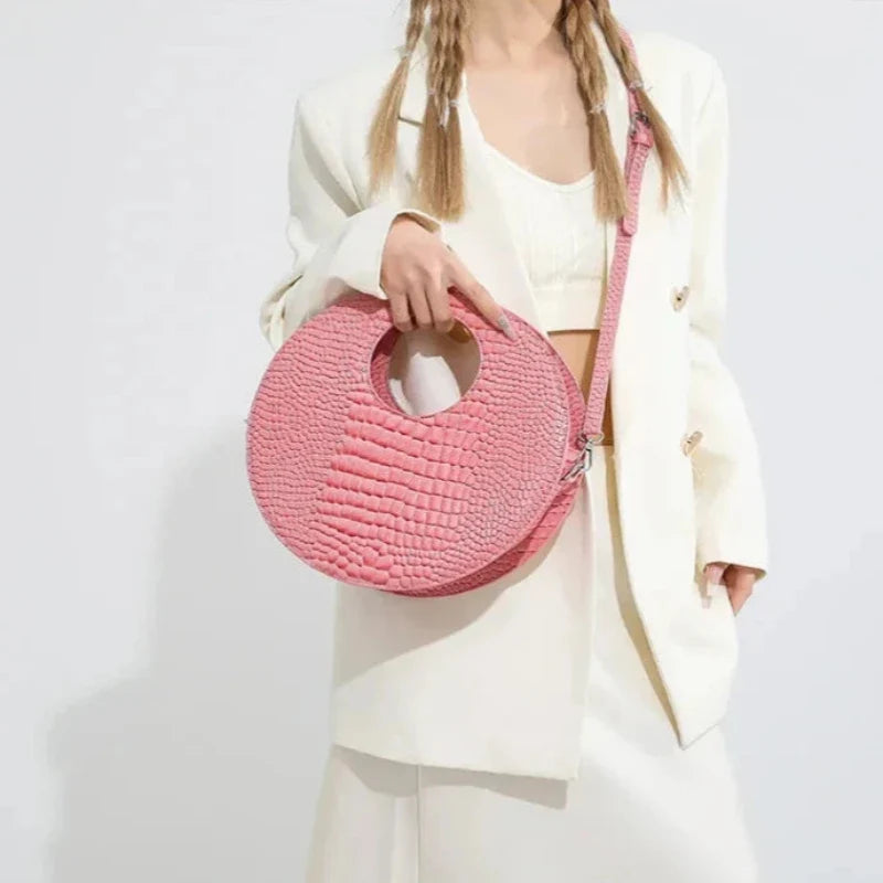 Sac rond avec finition effet crocodile