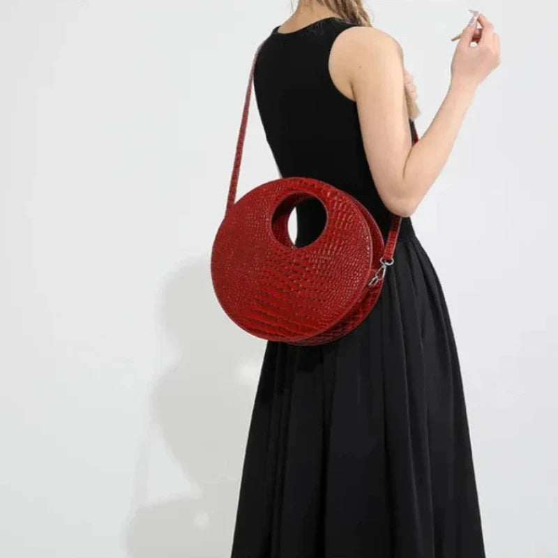 Sac rond façon crocodile à porter à la main