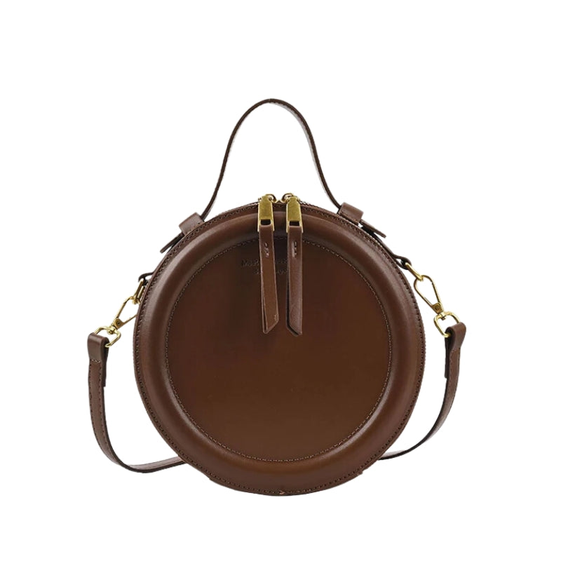 Sac rond original conçu pour être porté à main