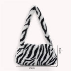 Sac zébré à main en fourrure synthétique
